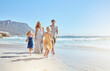 © Jade Maas/peopleimages.com - Joyful young family with two children running on the beach and enjoying summer vacation. Two energetic little girls running ahead while their mother and father follow in the background