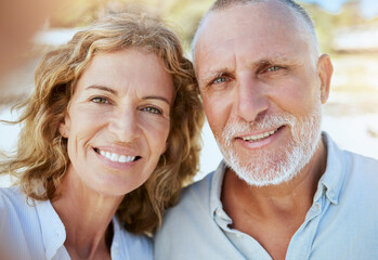 Poster - Portrait of happy mature caucasian couple taking a selfie while bonding together on holiday outdoors. Loving husband and wife capturing photos for memories while enjoying retirement and vacation