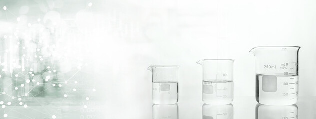 Wall Mural - clear glass beakers with with white data information in science lab banner background