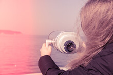 Tourist Looking Through Coin Operated Binoculars. Binocular Telescope On The Observation Deck For Tourism. Sea Background. Binoculars Watching At Horizon At Ship Deck. Discover New Places Travel