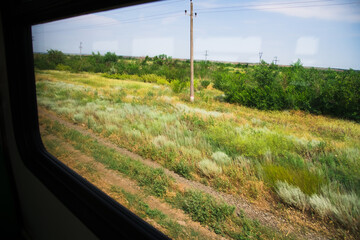 Wall Mural - View from the railway car to the landscape passing outside the train window