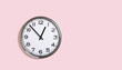 Big plain wall clock on pastel pink background. One o'clock. banner with copy space, time management or business concept and lunch time. Opening closing hours. Schedule working hours concept