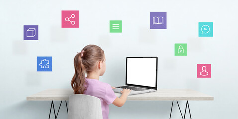 Canvas Print - little girl work on a laptop computer. internet of things concept. isolated laptop display for mocku