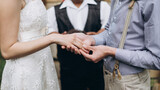 Fototapeta Boho - bride and groom holding hands