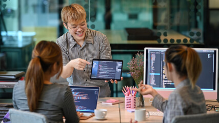 computer programming specialist team working on new project and planning for developing program