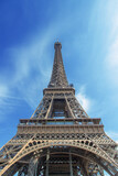 Fototapeta Miasta - Eiffel tower in summer against the sky. Selective focus.