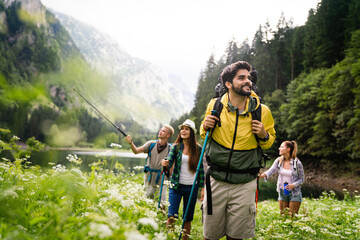 Wall Mural - group of happy friends enjoying outdoor activity together