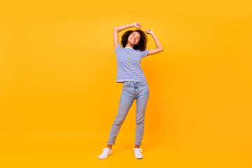 Canvas Print - Full size photo of adorable carefree girl closed eyes raise hands isolated on yellow color background