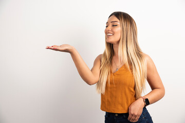 Wall Mural - Pretty woman posing on white background