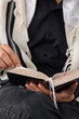 Vertical photo Close-up of a Jew with tallit reading the siddur on Shabbat.