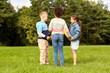 © Syda Productions - childhood, leisure and people concept - group of happy kids playing round dance at park