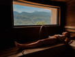 Woman laying down relaxing in the sauna