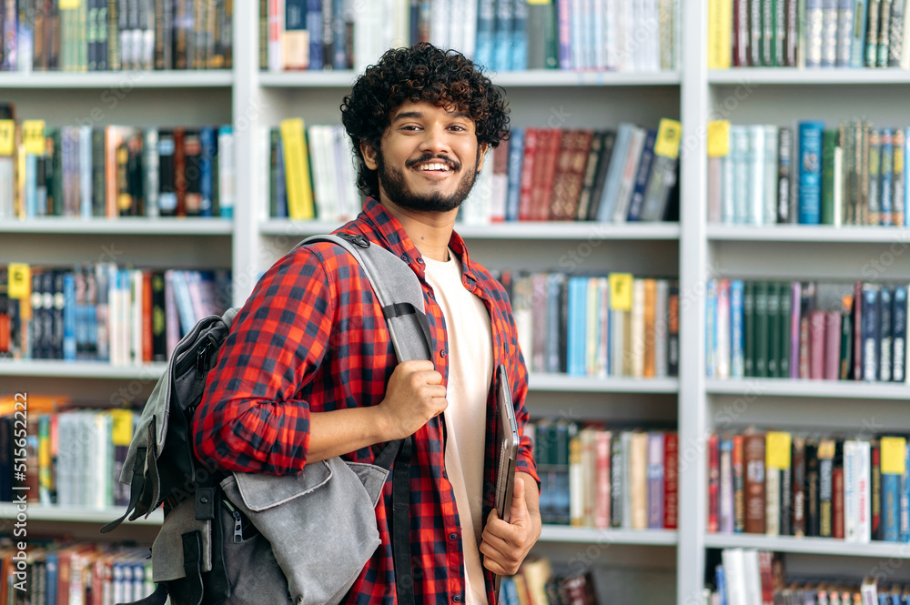 Handsome proud curly haired indian or arabian male student of ...