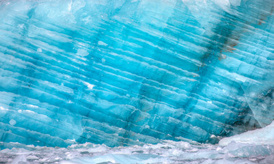Wall Mural - a close-up of the layered surface of a blue glacier - knud rasmussen glacier near kulusuk - greenlan