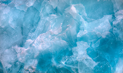 a close-up of the layered surface of a blue glacier - knud rasmussen glacier near kulusuk - greenlan