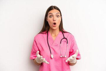 Wall Mural - pretty woman feeling extremely shocked and surprised. nurse concept