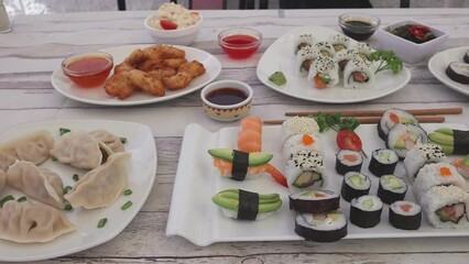 Canvas Print - Closeup of delicious sushi sets on white plates