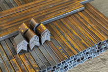 Metal Pipes Cut And Stacked In A Pile