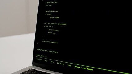 Developer is browsing html code on the computer screen. Scroll of HTML Web Page Code. Programming code abstract technology background. Computer script concept. High quality 4k footage