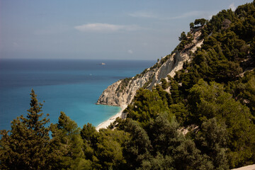 Wall Mural - lefkas cliffs in greece with many trees by the sea coastline