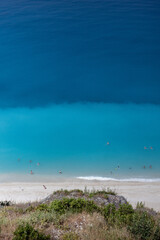 Wall Mural - wonderful clear lefkas greece water and the egremni beach from above with some people swimming