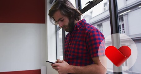 Canvas Print - Heart red icon over round banner against caucasian man using smartphone near the window at office