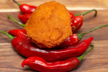 .Traditional Brazilian black-eyed pea dumplings over red peppers - Typical food from Bahia.