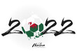 2022 and soccer ball in flag colors of Wales