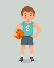 Cute Little Boy With Sportswear Holding Basketball Standing Posing With Hand On His Waist