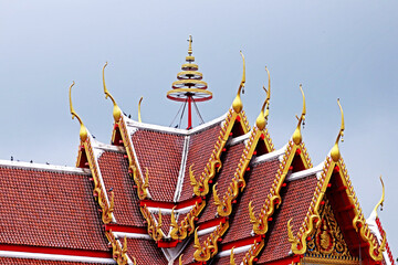 Wall Mural - Traditional Thai style Naga stucco on the roof in Thai temple