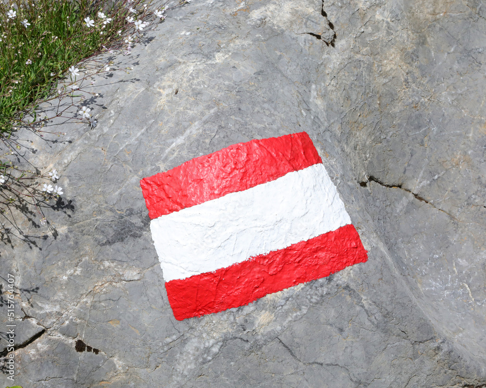 white and red color to signal the path in the mountains on a rock Stock ...