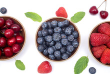 Set Of Blueberries, Strawberries And Cherry In The Bowl On White Background, Closeup