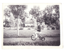 Vintage Photo Of Little Girl On Old Bicycle Outdoor