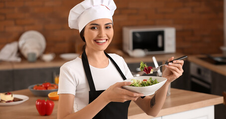 Sticker - Female chef with tasty vegetable salad in kitchen