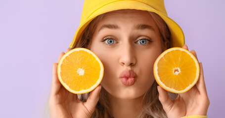 Sticker - Cute young woman with cut orange on lilac background