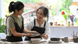 © Prathankarnpap - Senior woman and her daughter creating handmade ceramic bowl in workshop. Indoors lifestyle activity, handicraft, hobbies concept