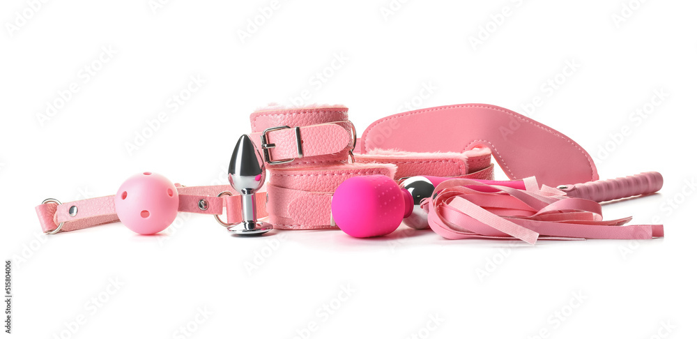 Different toys from sex shop on white background