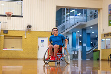 Young Man In Sports Wheelchair At Indoor Basketball Centre