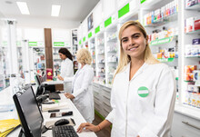 Portrait Of Female Pharmacist In Drugstore.