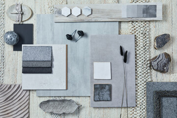 Flat lay design of creative architect moodboard composition with samples of building, beige textile and natural materials and personal accessories. Top view, template.