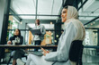 © Jacob Lund - Happy Muslim businesswoman sitting in an office meeting