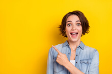 Photo Of Young Excited Girl Indicate Finger Empty Space Ads Decision Select Discount Isolated Over Yellow Color Background