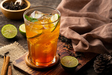 Thai Soft Drink,Lime Iced Tea,black Tea With Lime Juice And Sugar,garnished With Lime Slices And Mint In Glass