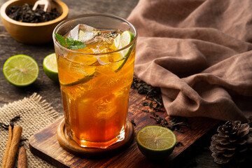 Thai Soft drink,Lime Iced Tea,black tea with lime juice and sugar,garnished with lime slices and mint in glass