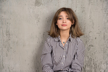 photo of a young pretty woman sitting and posing