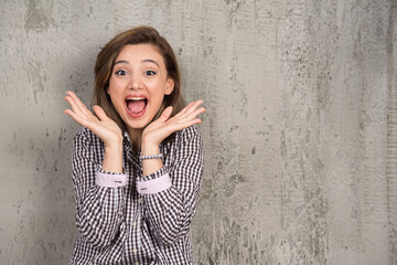 Wall Mural - Photo of a young pretty woman sitting and posing