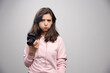 © rastockinc - Young woman with camera feeling sad