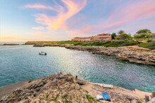 Sunset At The Rocky Coastline Along The Mediterranean Sea At The Spanish Town Of Binebaca Vell On The Island Of Menorca, Spain.