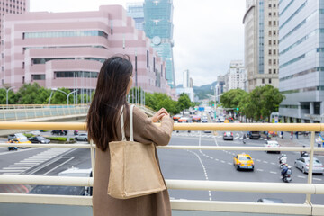 Canvas Print - Woman look at the city view in Taiwan