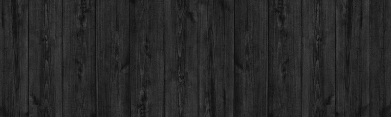 Wall Mural - Black natural shabby fine textured wood board panoramic background. Rough old grainy wooden plank dark wide texture